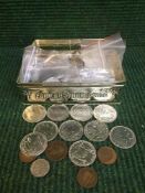 A tin of assorted British and European coins, fantasy coins,