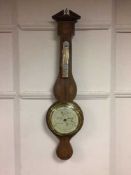 An inlaid mahogany cased banjo barometer