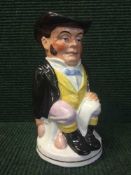 An early 20th century English pottery toby jug