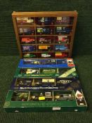 Four boxed Lledo triple pack die cast delivery vehicles and buses,