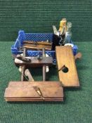 A basket of wood working planes, antique bottles, silver plated cutlery,