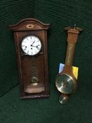 A contemporary inlaid mahogany Westminster chime wall clock and a banjo barometer