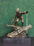 A bronze figure on marble plinth - snow boarder