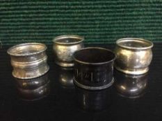 Four sterling silver napkin rings
