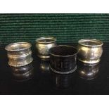 Four sterling silver napkin rings