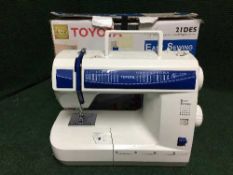 A boxed Toyota 21DES electric sewing machine