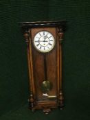 A mahogany cased Vienna wall clock