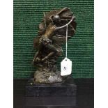 A bronze figure on marble plinth - rock climber