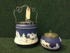 A Wedgwood jasper ware biscuit barrel with matching sugar basin