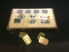 A pair of cased 12 carat gold cuff links and a set of silver studs