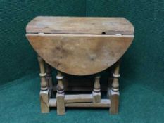 A small pine drop leaf table