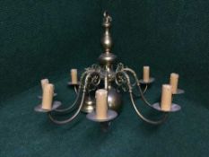 A brass eight branch chandelier