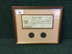 A framed Newark Bank promissory £1 note dated 1808 and two Newark tokens
