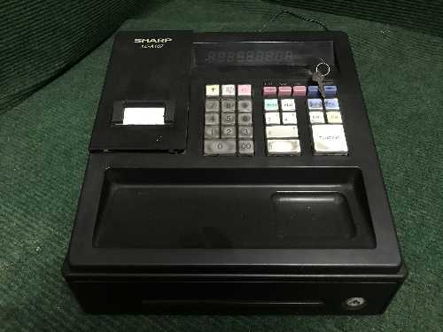 A Sharp XE-A107 cash register with keys