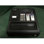 A Sharp XE-A107 cash register with keys
