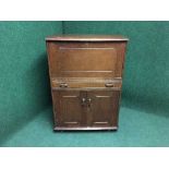 An Ercol oak cocktail cabinet