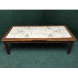 A 1970's teak tiled topped coffee table