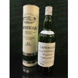 A bottle of Laphroaig Unblended Malt 10 Years Old Scotch Whisky (Factory sealed but level below