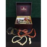 A box of beaded and costume jewellery - necklaces, brooches,