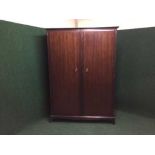 A mahogany stag double door wardrobe