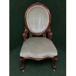 A Victorian mahogany nursing chair