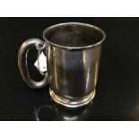 A sterling silver mug,