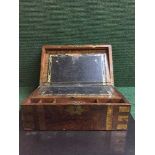 A Victorian rosewood brass bound writing box