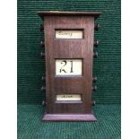 An oak cased scroll calendar