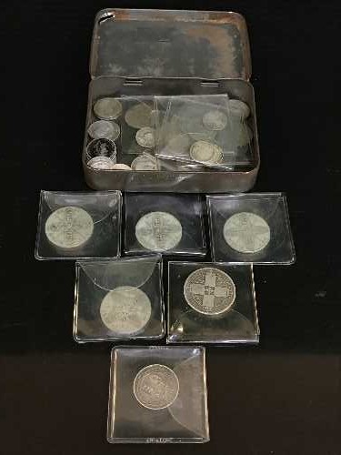 A tin containing assorted Georgian and later coins, some silver, florins, shillings,