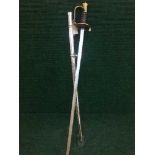 A military basket handled sword in scabbard