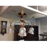 An Arts and Crafts copper light fitting in the style of W A S Benson