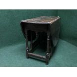 A late 19th century oak gate leg table fitted a drawer