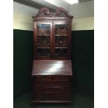 A reproduction Regency style bureau bookcase