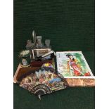 A tray of hand fans, tins, miniature printing set,