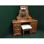 A contemporary dressing table with stool