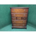 A mahogany stag seven drawer chest