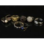 Eight yellow metal dress rings, including one set with diamonds, 27.