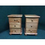 A pair of pine three drawer bedside chests