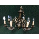 A brass eight way light fitting