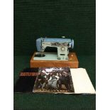 A Brother electric sewing machine a small bundle of lps including Simple Minds,