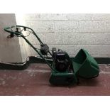 A Qualcast petrol cylinder lawn mower