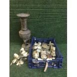 An antique bronzed embossed vase and a basket of plated cutlery,