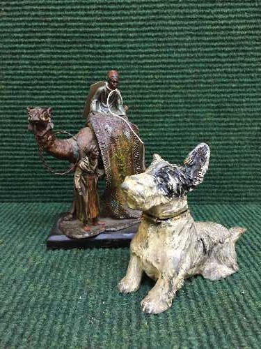 Two metal table lighters modelled as Arabian figures on camel and a dog