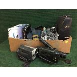 A box of manual typewriter, assorted cameras, Sat Nav,