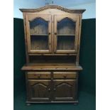 A pine glazed door kitchen dresser