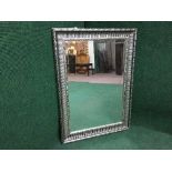 A contemporary silvered framed mirror