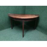 A Victorian mahogany d-shaped table