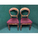 A pair of Victorian mahogany balloon backed chairs