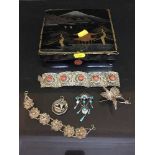 An oriental lacquered box containing continental and sterling silver jewellery