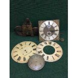 A tray of two Grandfather clock faces with movements